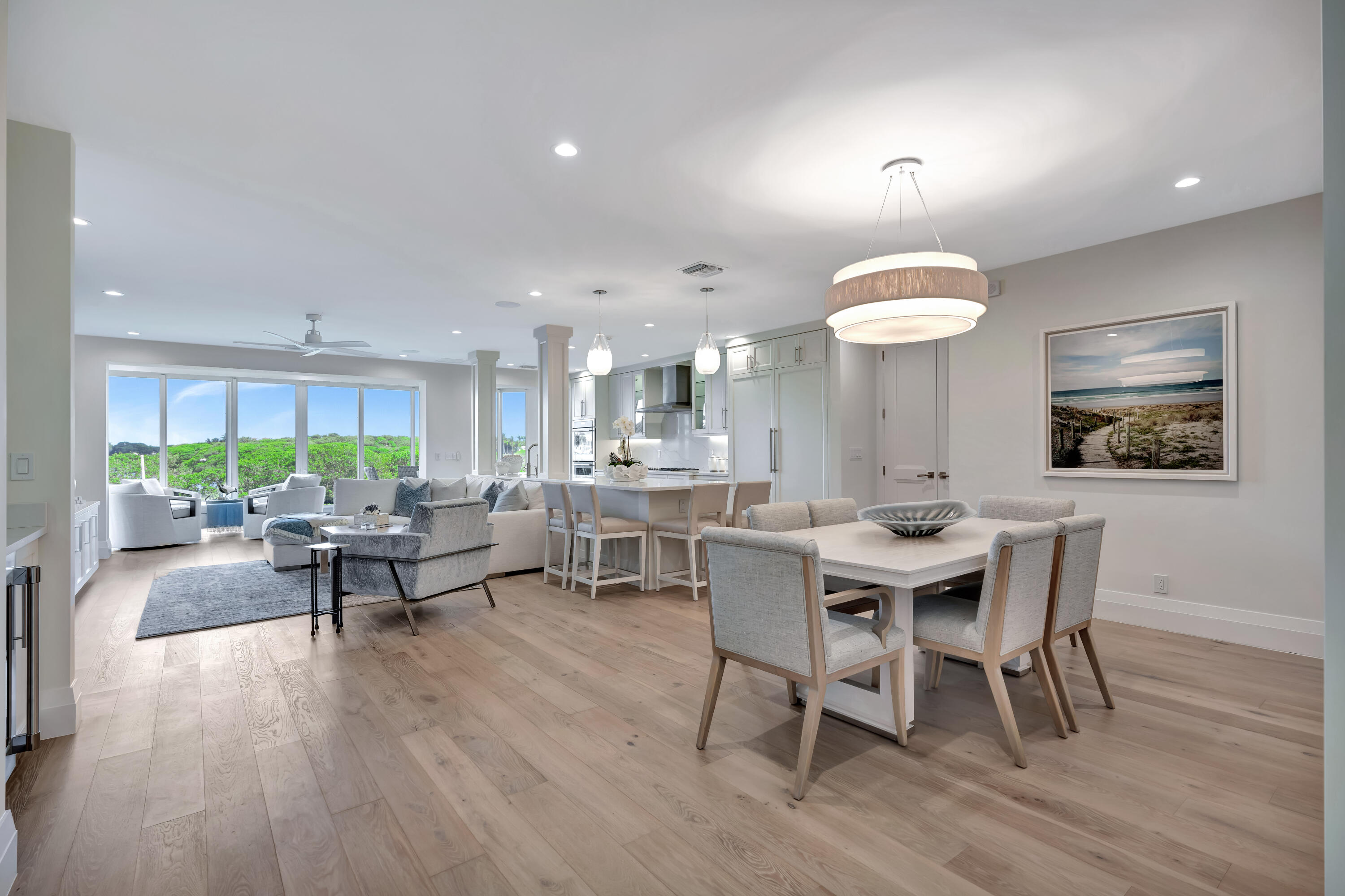 260 Eagle Drive Jupiter, FL 33477 - Photo 3 of 41 a view of a dining room with furniture window and wooden floor