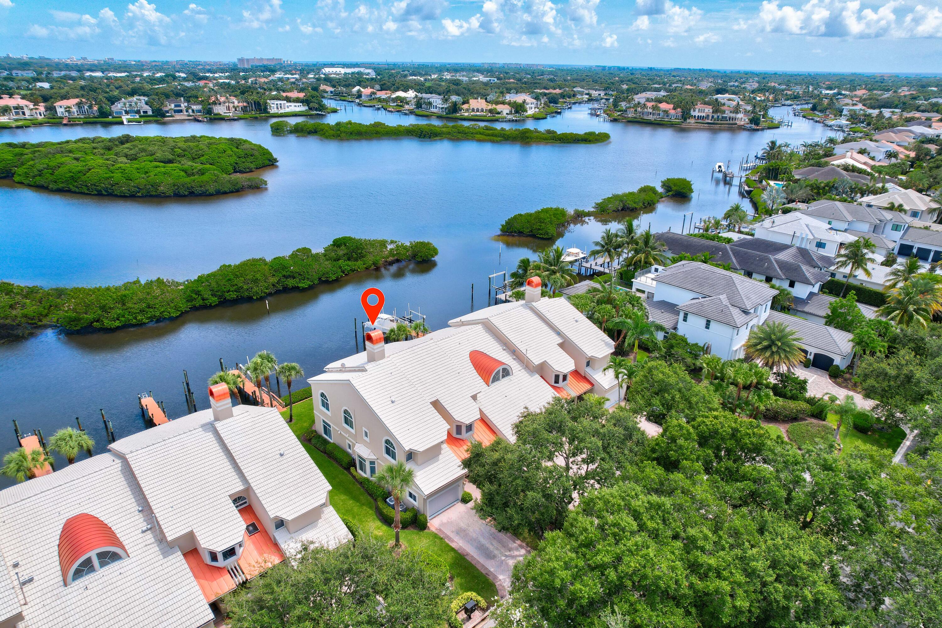 260 Eagle Drive Jupiter, FL 33477 - Photo 36 of 41 an aerial view of residential houses with outdoor space and lake view