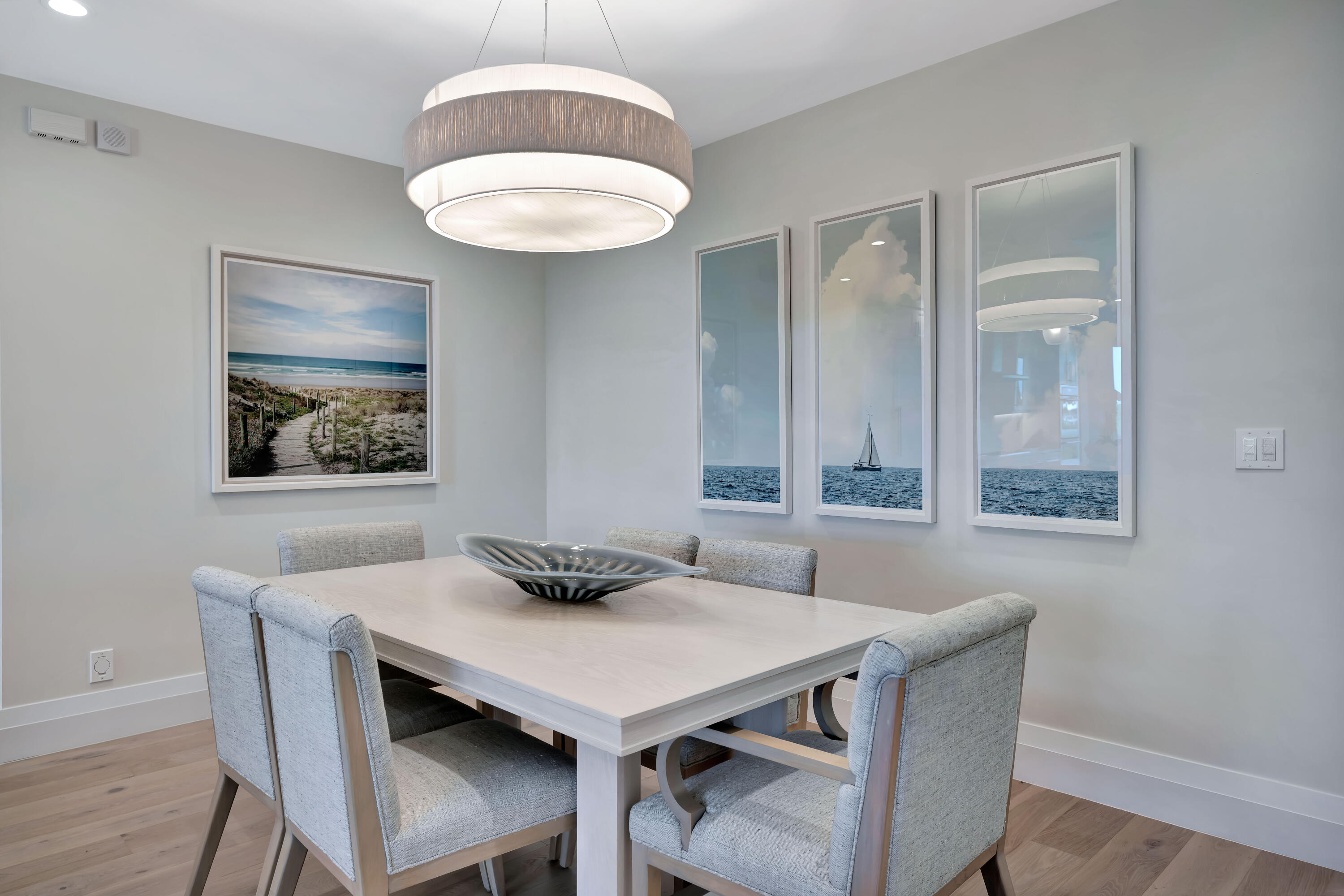 260 Eagle Drive Jupiter, FL 33477 - Photo 4 of 41 a view of a dining room with furniture and wooden floor