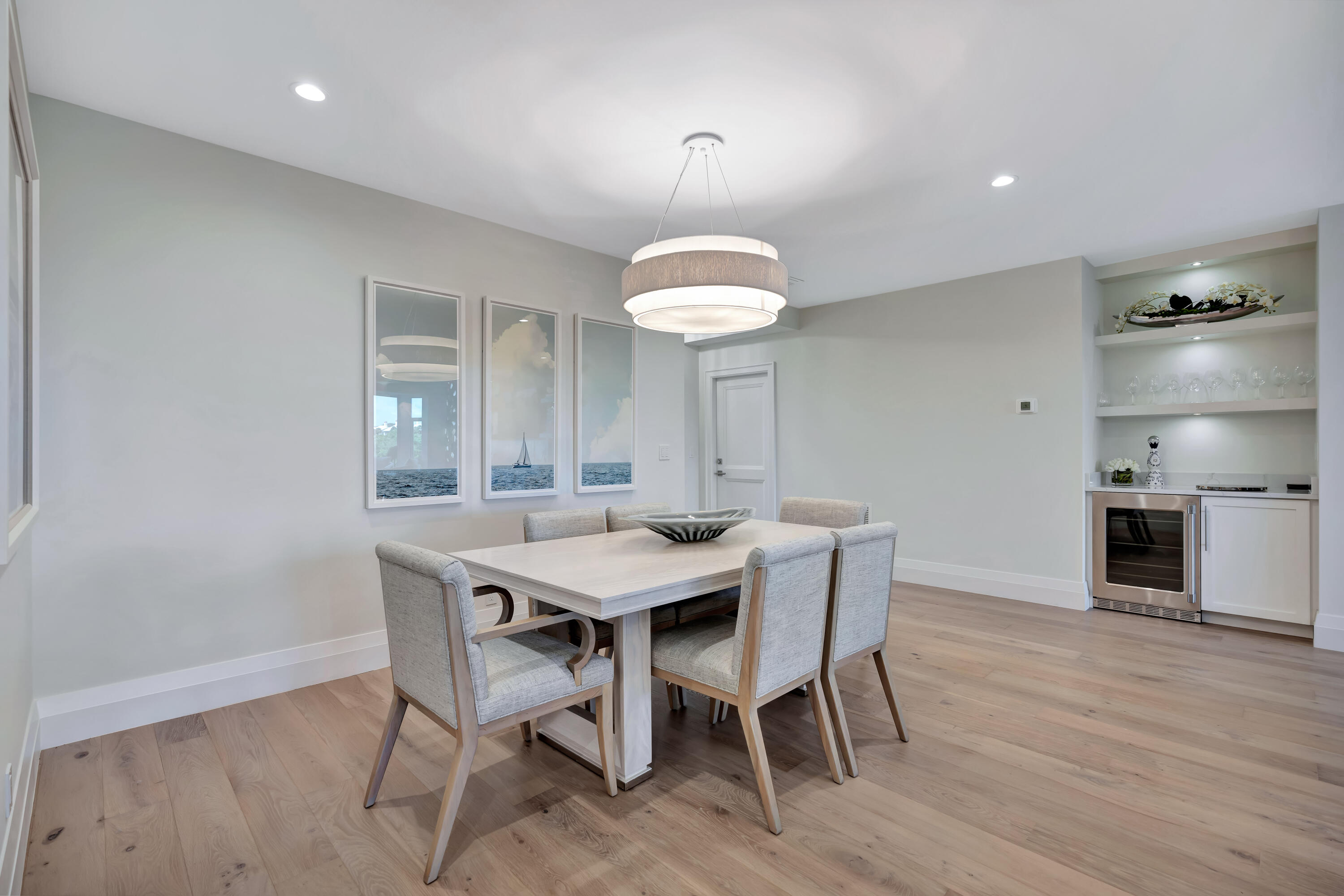 260 Eagle Drive Jupiter, FL 33477 - Photo 5 of 41 a view of a dining room with furniture window and wooden floor