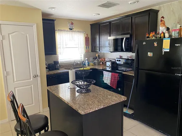 a bed room with a bed and a television