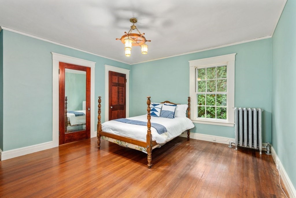 17 Berwick Road Newton, MA 02459 - Photo 23 of 35 a spacious bedroom with a bed and a window