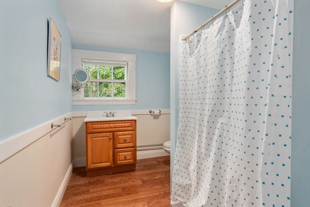 17 Berwick Road Newton, MA 02459 - Photo 26 of 35 a view of a hallway with wooden floor and a window