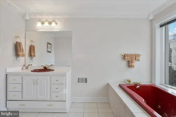 a view of a building with a bench in a patio