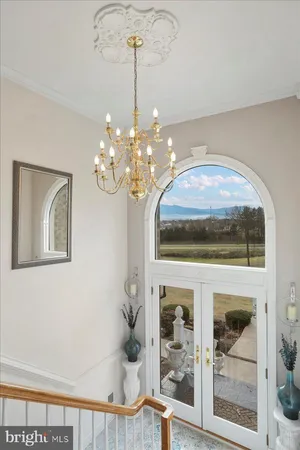 a kitchen with granite countertop a sink a stove and a counter space