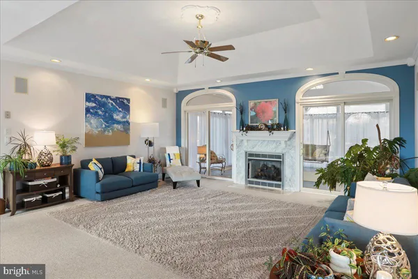 a kitchen with stainless steel appliances kitchen island granite countertop a sink a stove counter space and cabinets