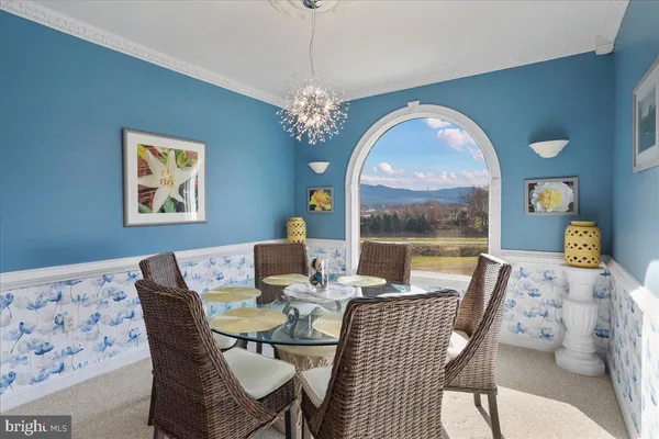 a spacious bedroom with a bed couch and window