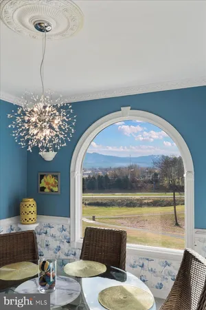 a spacious bathroom with a sink a toilet a mirror and a tub
