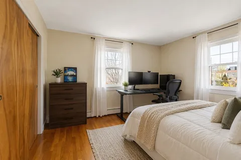 a bedroom with a bed and furniture