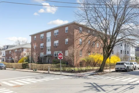a view of a building with a street