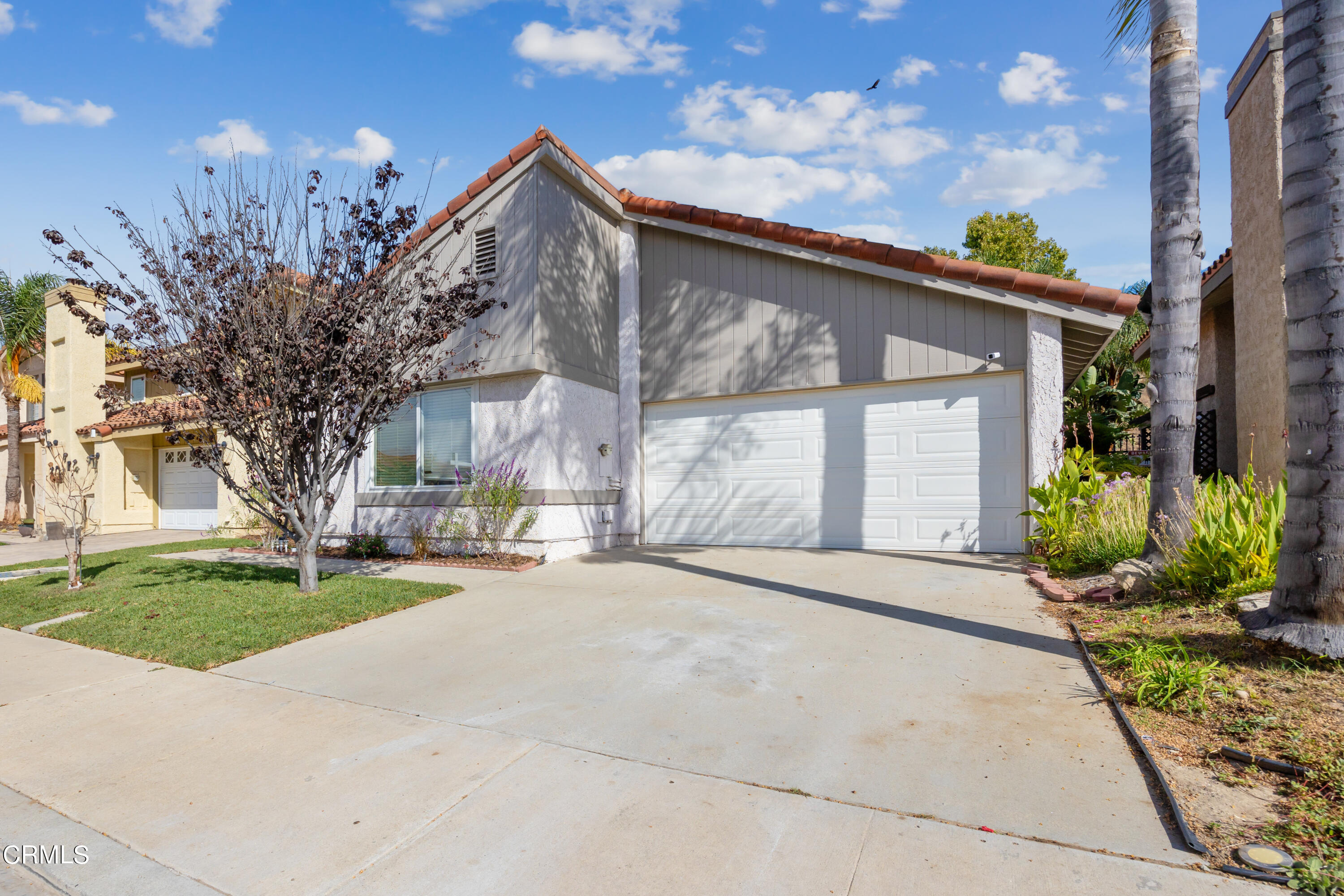 6464 Melray Street Moorpark, CA 93021 - Photo 2 of 57 a view of a house with a yard and garage