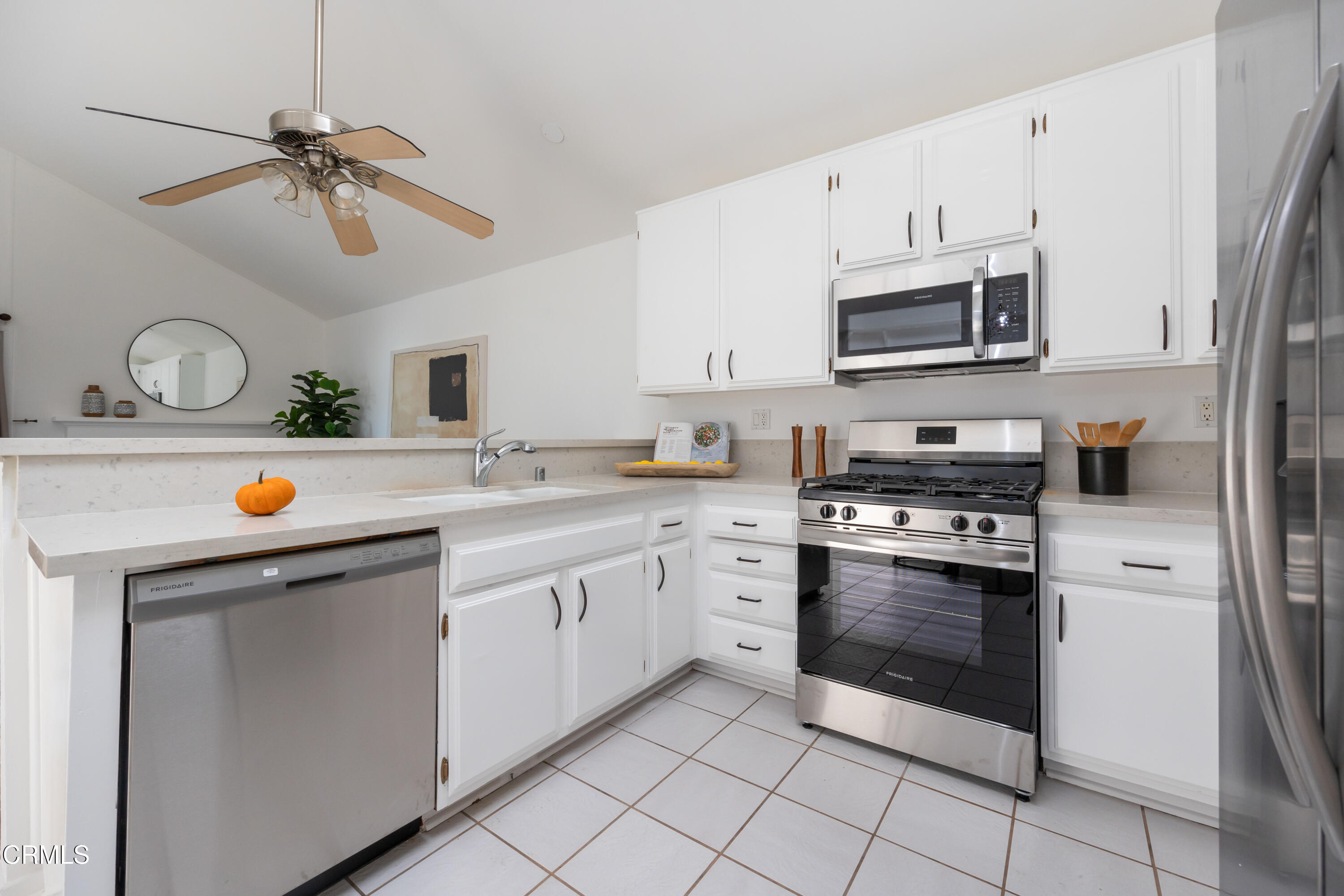 6464 Melray Street Moorpark, CA 93021 - Photo 23 of 57 a kitchen with stainless steel appliances granite countertop white cabinets a sink and dishwasher