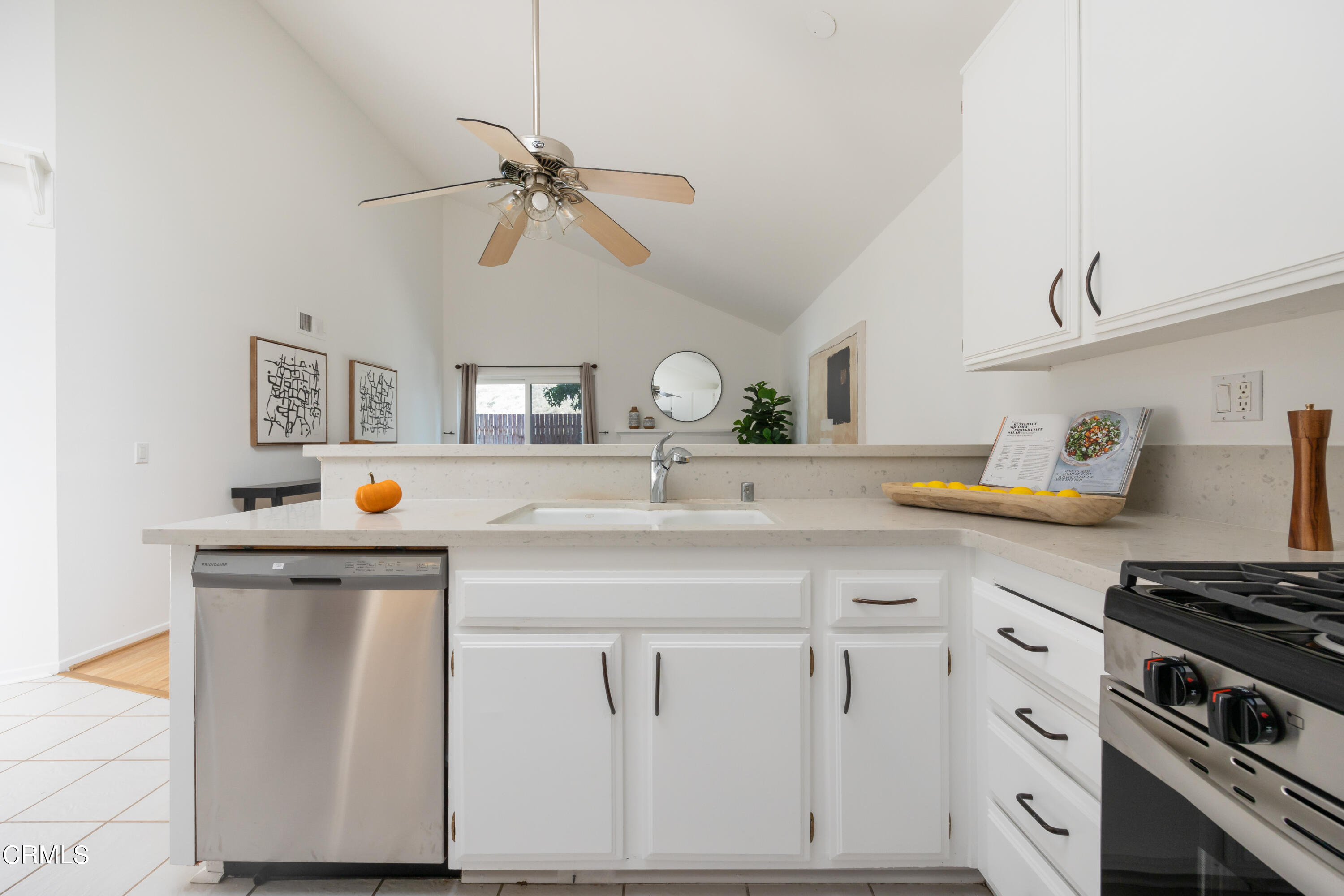 6464 Melray Street Moorpark, CA 93021 - Photo 27 of 57 a kitchen with white cabinets and appliances