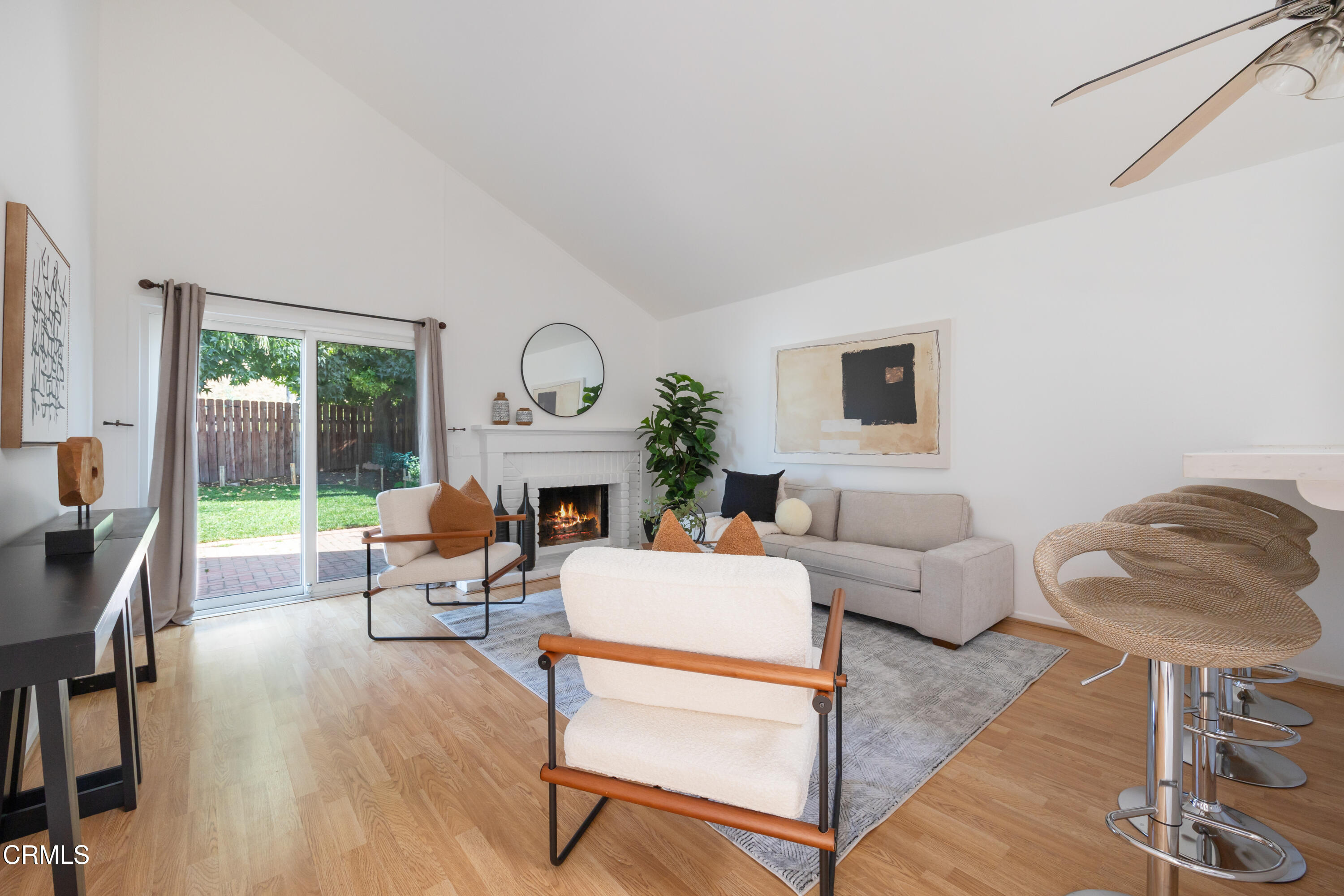 6464 Melray Street Moorpark, CA 93021 - Photo 28 of 57 a living room with fireplace furniture and a large window