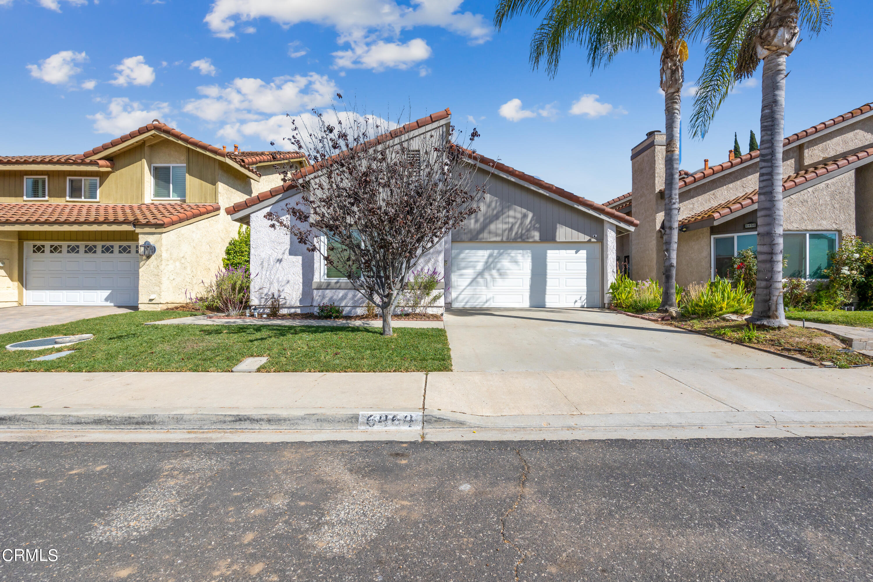 6464 Melray Street Moorpark, CA 93021 - Photo 3 of 57 a front view of a house with a yard and garage
