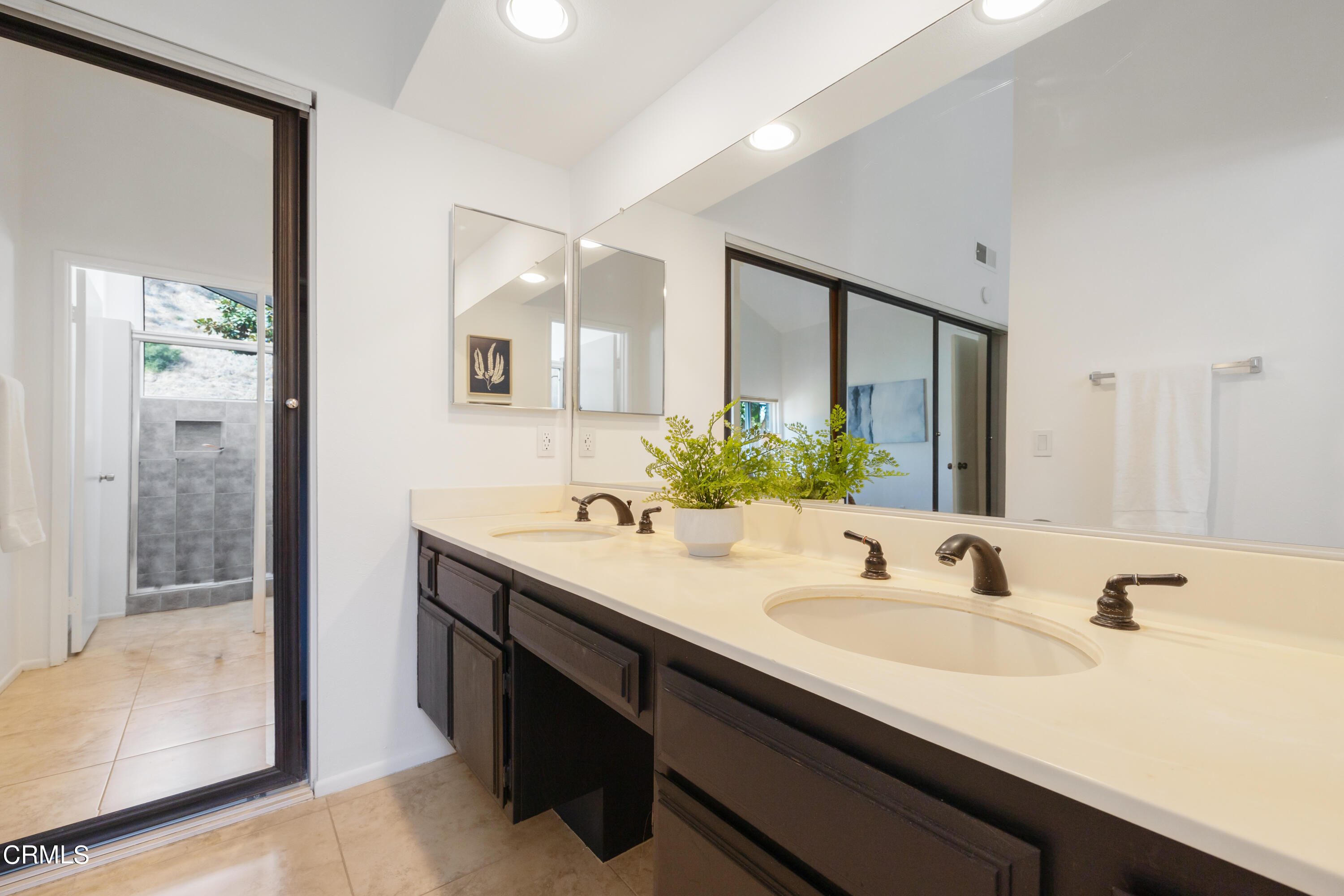 6464 Melray Street Moorpark, CA 93021 - Photo 41 of 57 a bathroom with a sink and a mirror