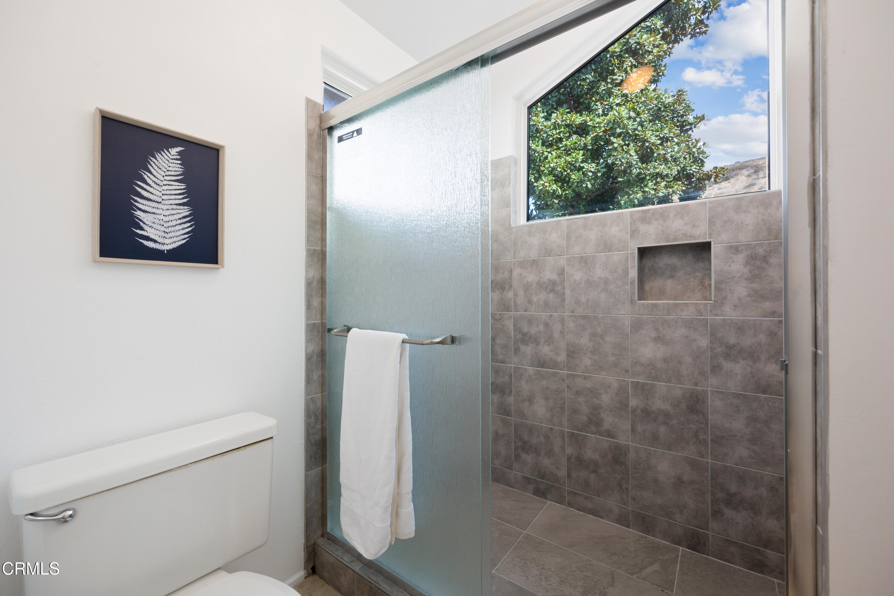 6464 Melray Street Moorpark, CA 93021 - Photo 42 of 57 a bathroom with a toilet and a shower