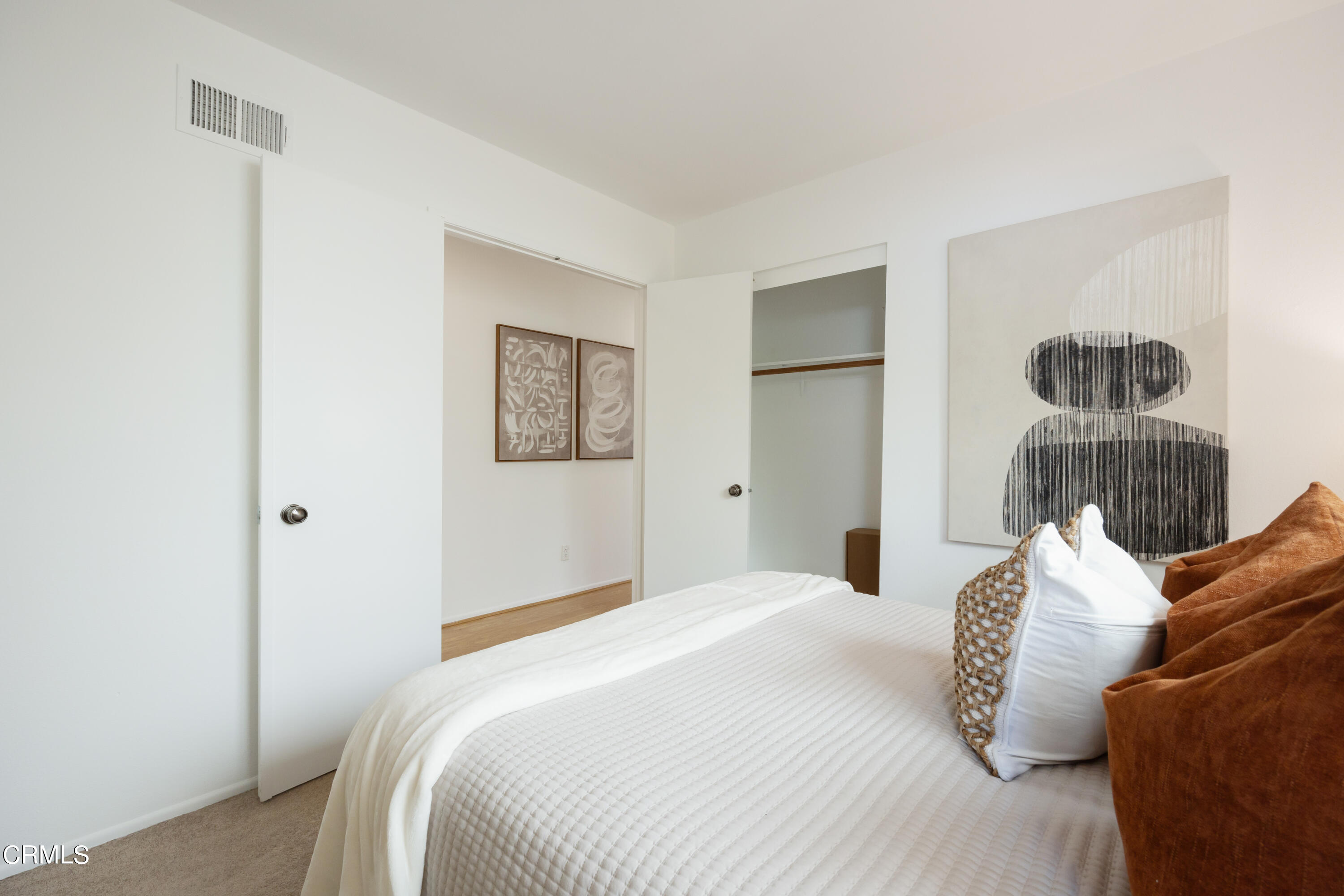 6464 Melray Street Moorpark, CA 93021 - Photo 45 of 57 a bedroom with a bed and a painting on the wall