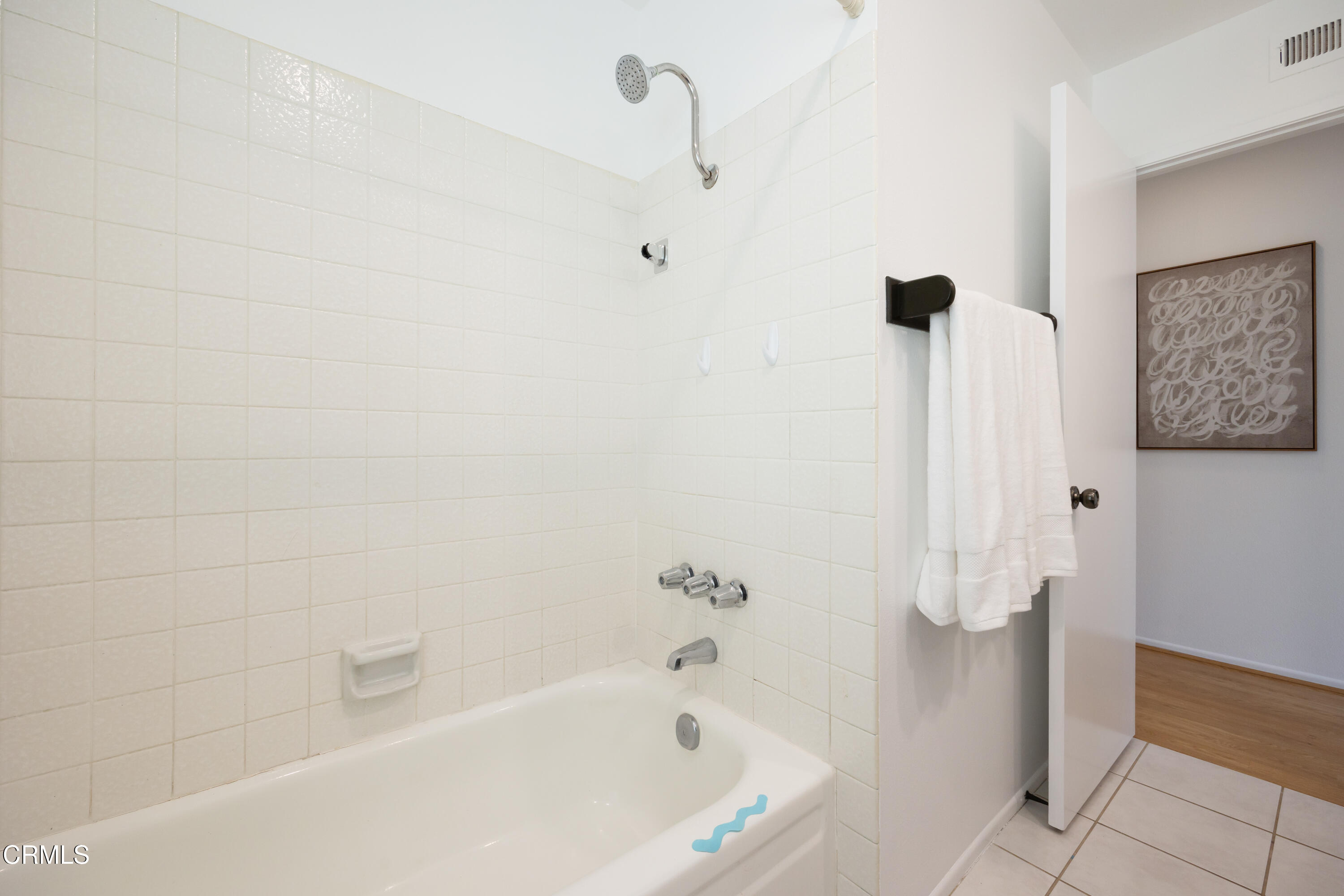 6464 Melray Street Moorpark, CA 93021 - Photo 47 of 57 a bathroom with a bathtub and shower