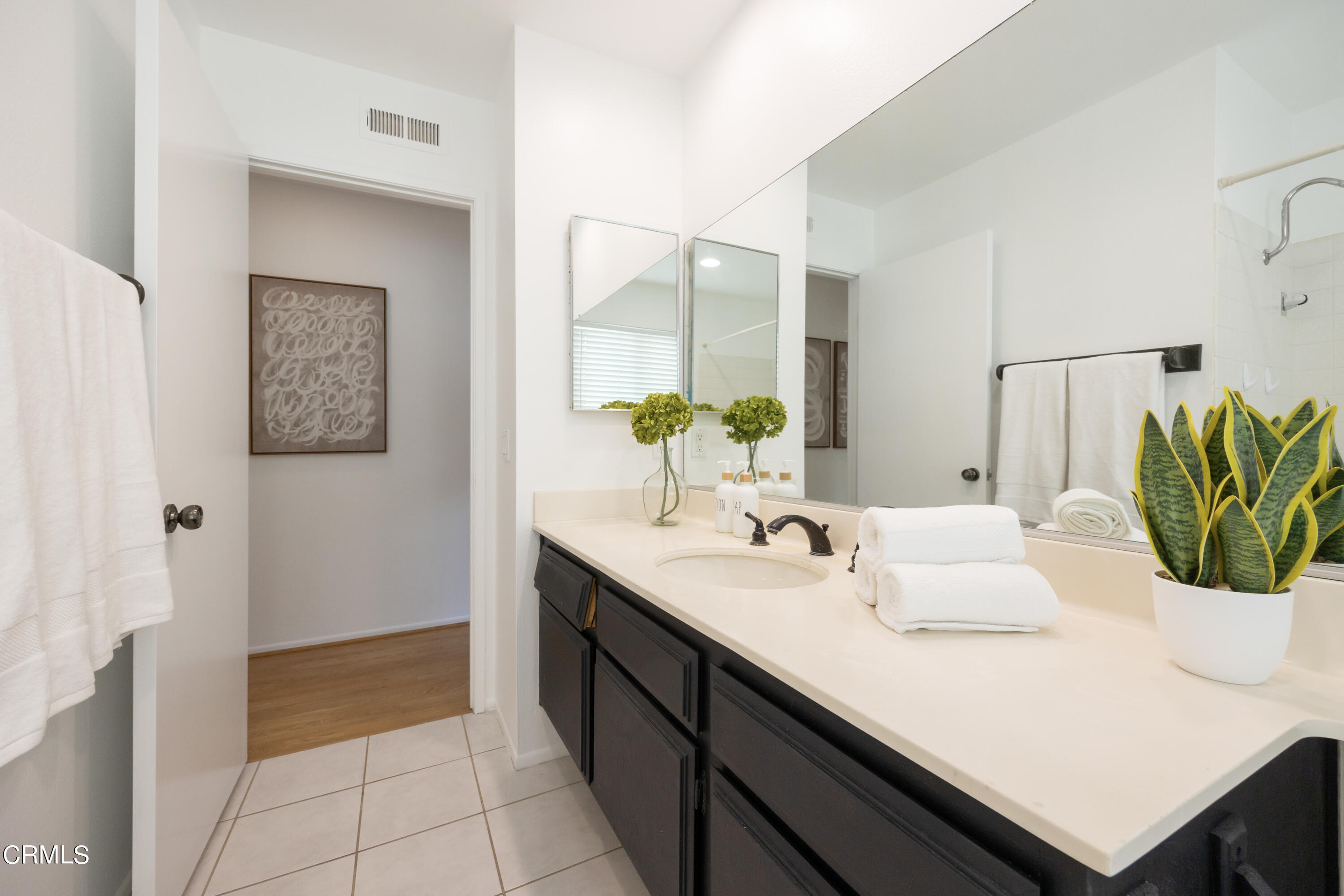 6464 Melray Street Moorpark, CA 93021 - Photo 48 of 57 a bathroom with a sink and a mirror