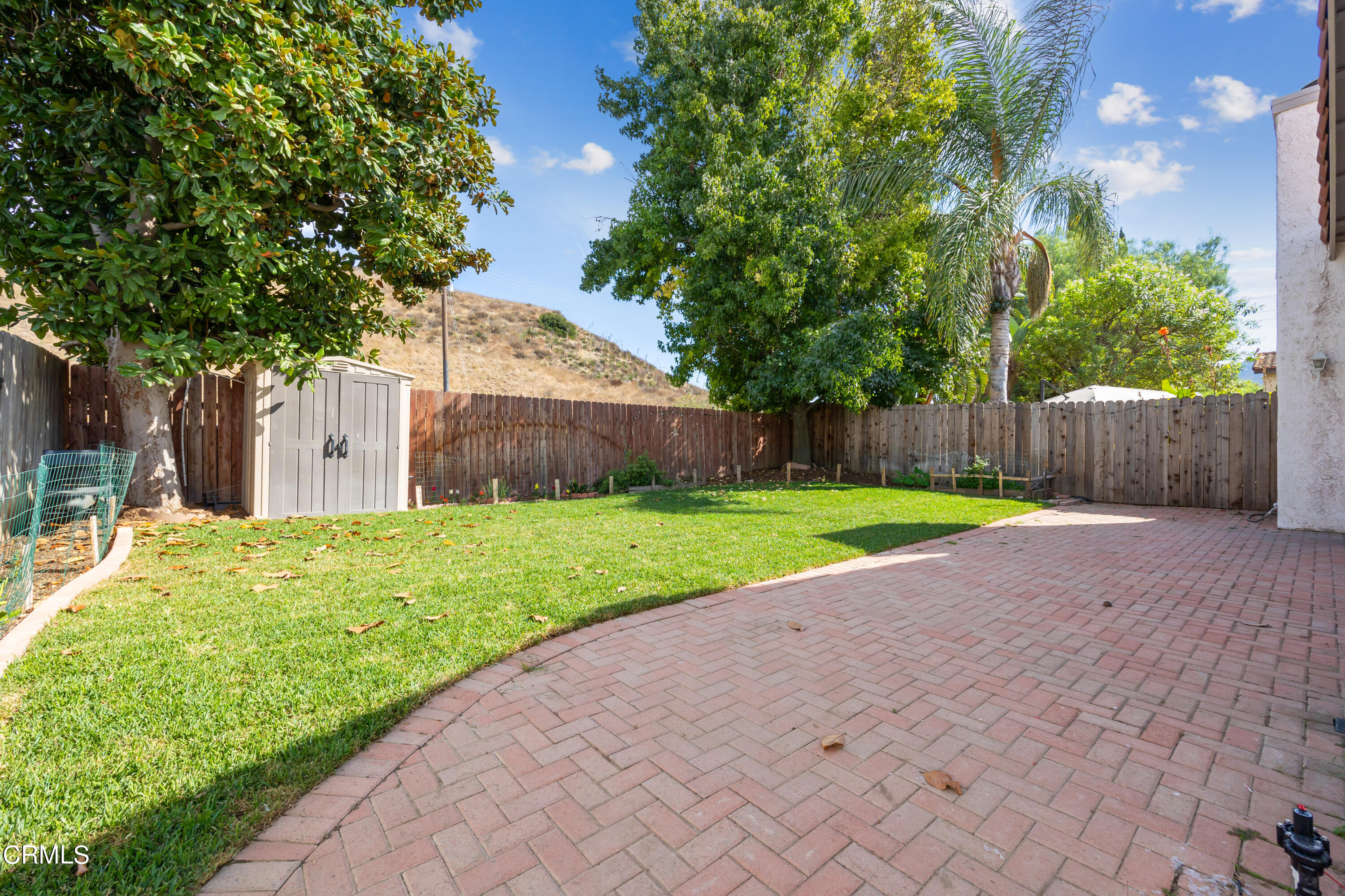 6464 Melray Street Moorpark, CA 93021 - Photo 54 of 57 a view of a house with a yard and large tree
