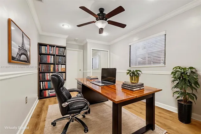 a view of a workspace with furniture and a potted plant