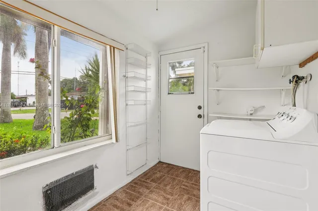 a utility room with dryer and washer