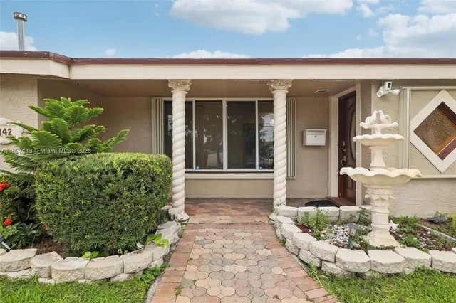 a view of a backyard with plants