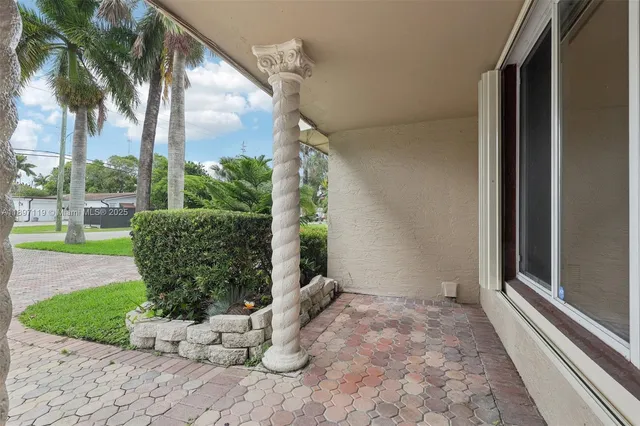 a view of door with wooden floor