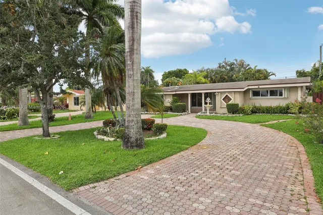 a view of an empty room and glass door