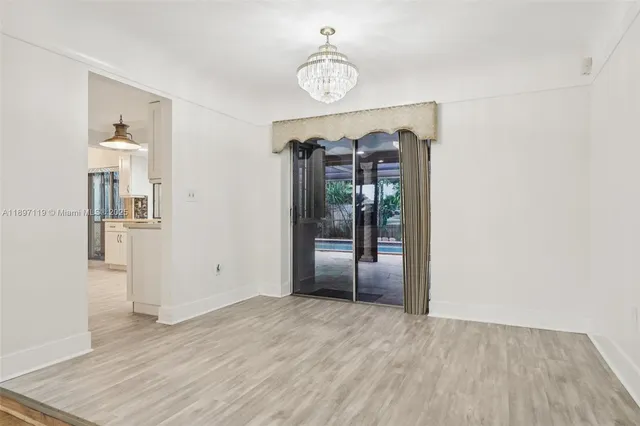 a kitchen with stainless steel appliances granite countertop a stove and a sink
