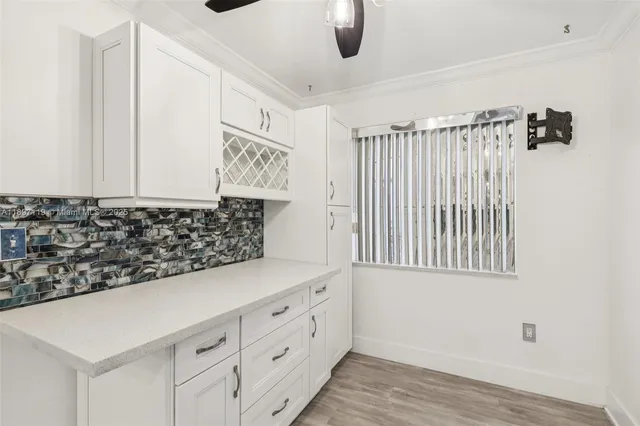 a view of an empty room with glass door