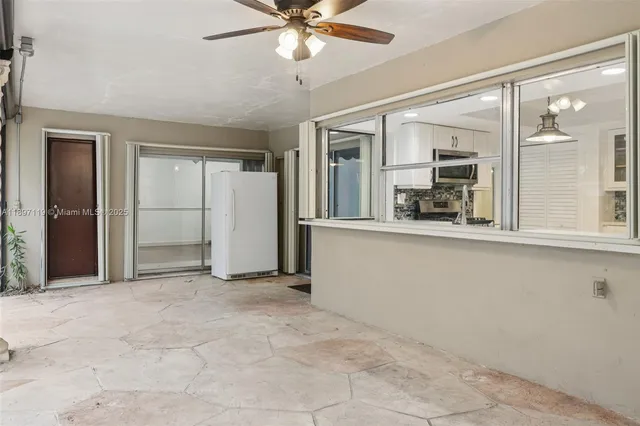 a view of a house with swimming pool and sitting area