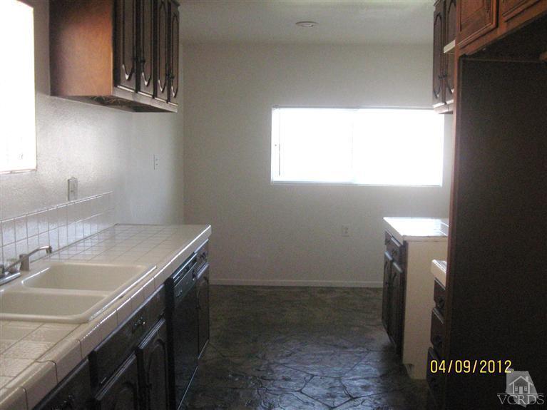 1408 West Guava Street Oxnard, CA 93033 - Photo 2 of 9 a bathroom with a sink and a vanity