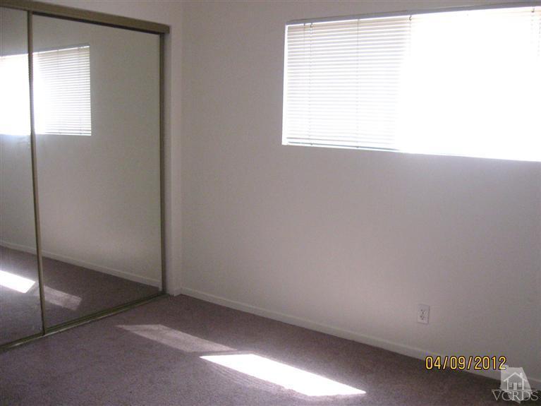 1408 West Guava Street Oxnard, CA 93033 - Photo 5 of 9 a view of an empty room with a window