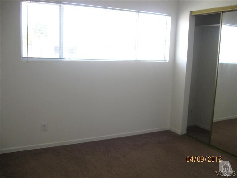 1408 West Guava Street Oxnard, CA 93033 - Photo 6 of 9 an empty room with a window