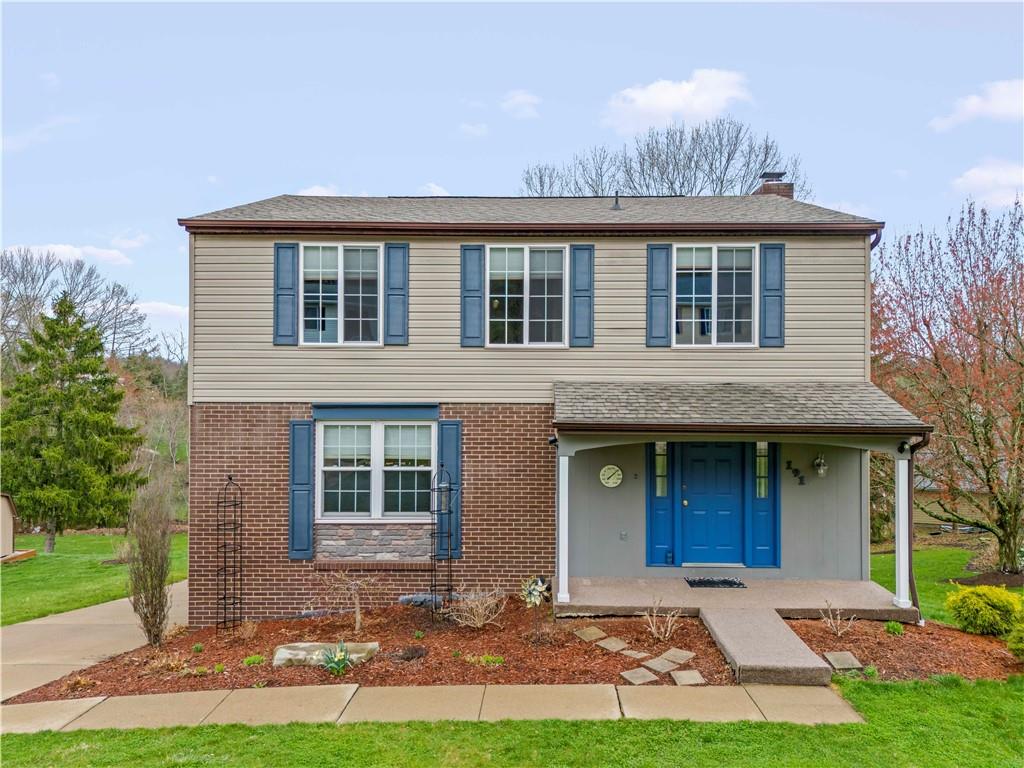 front view of a house with a yard