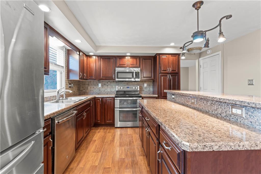 191 Deer Drive Washington, PA 15301 - Photo 12 of 33 a kitchen with stainless steel appliances granite countertop sink stove and refrigerator