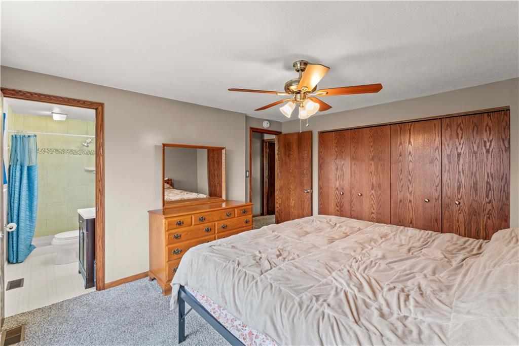 191 Deer Drive Washington, PA 15301 - Photo 18 of 33 a bedroom with a bed and a chandelier