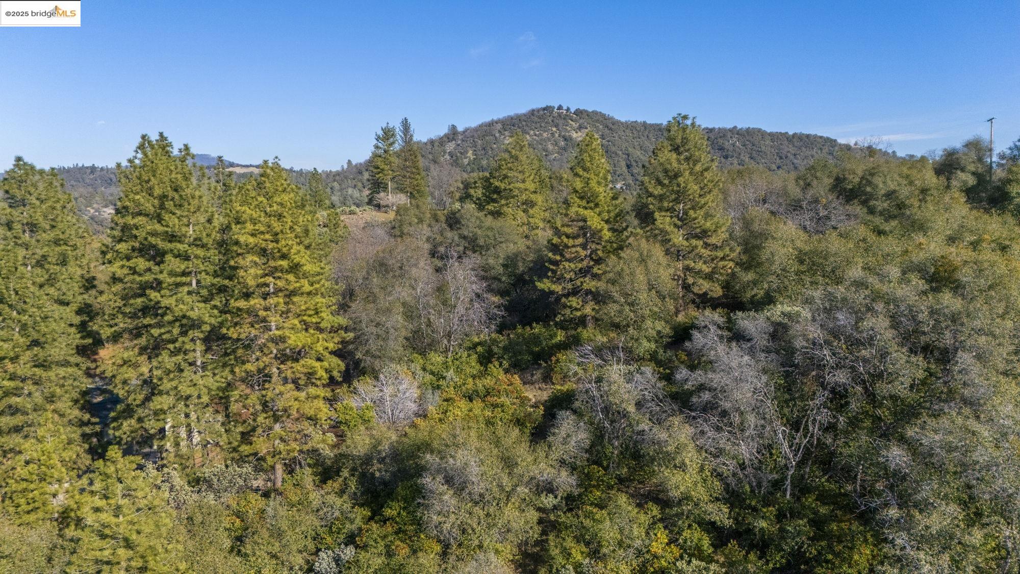 Par A Par A Robin Ridge Sonora, CA 95370 - Photo 13 of 14 a view of a large building with a mountain in the background