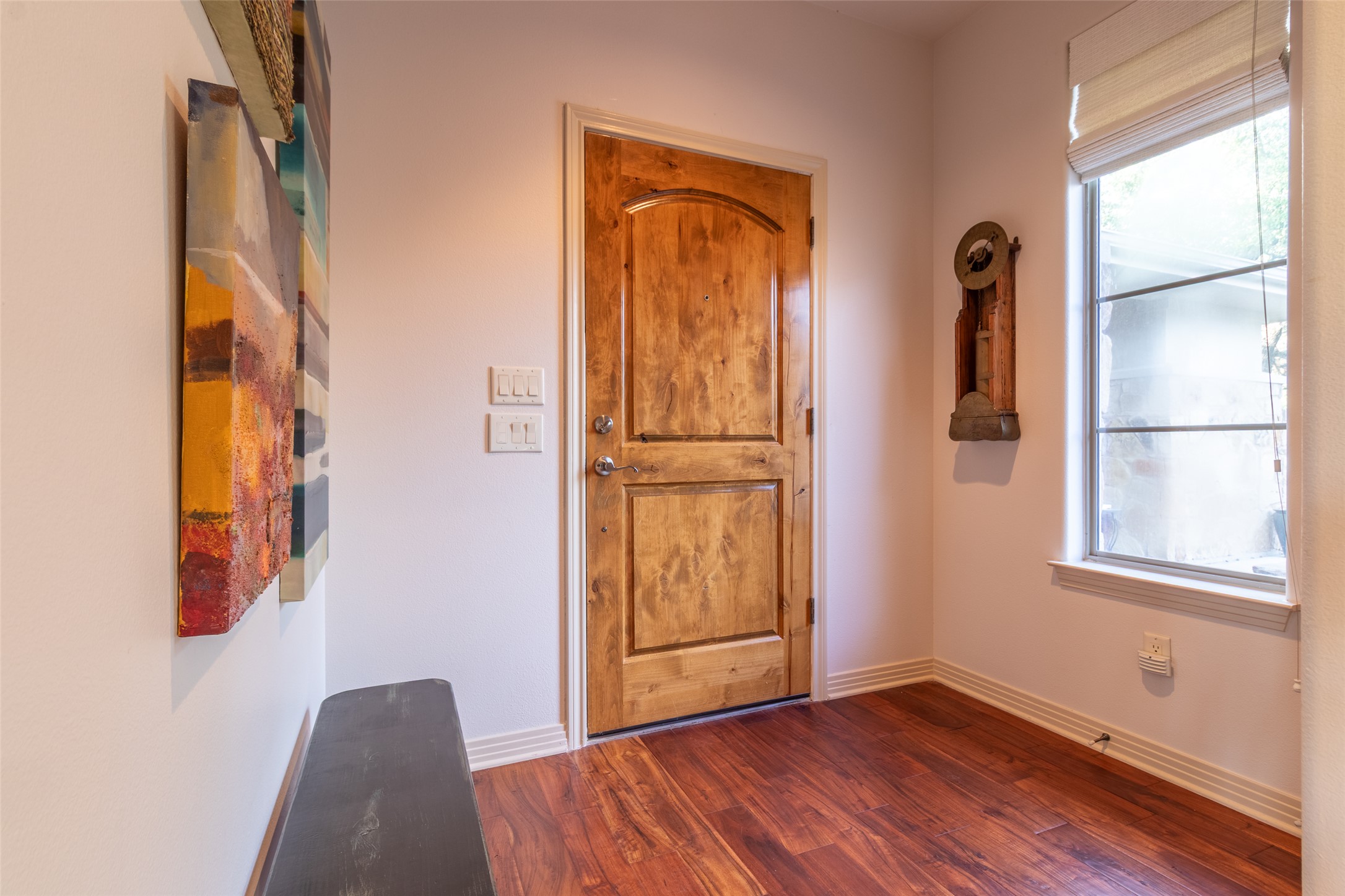 515 E Trail Spicewood, TX 78669 - Photo 13 of 36 a view of an empty room with window and wooden floor