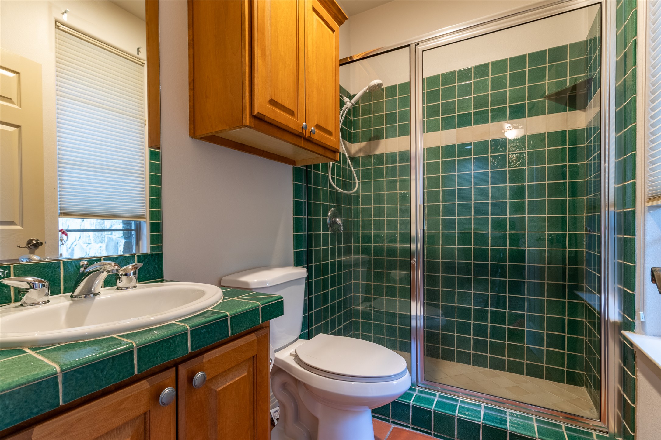 515 E Trail Spicewood, TX 78669 - Photo 34 of 36 a bathroom with a sink a toilet and shower