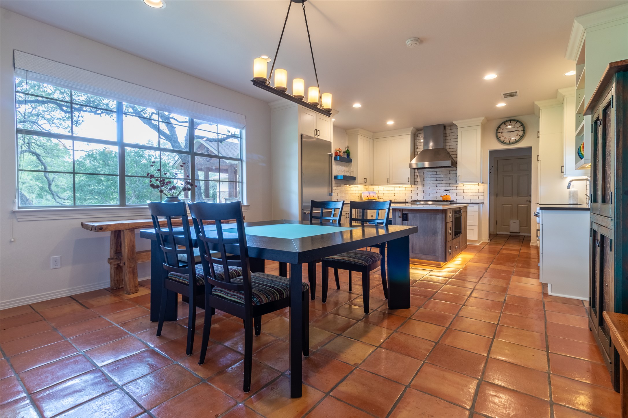 515 E Trail Spicewood, TX 78669 - Photo 4 of 36 a view of a dining room with furniture window and wooden floor