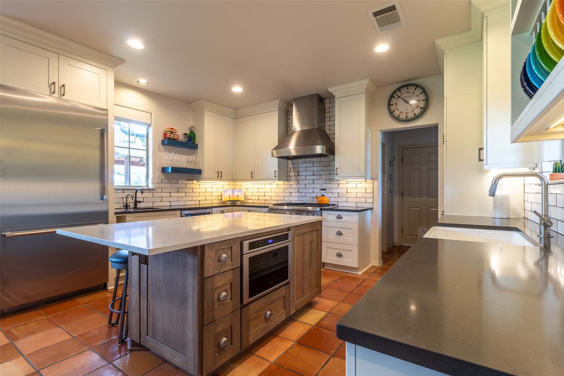 515 E Trail Spicewood, TX 78669 - Photo 5 of 36 a kitchen with stainless steel appliances granite countertop a stove and a refrigerator