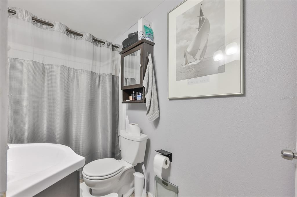 1208 17th Street North St. Petersburg, FL 33713 - Photo 13 of 15 a white toilet sitting next to a small bathroom