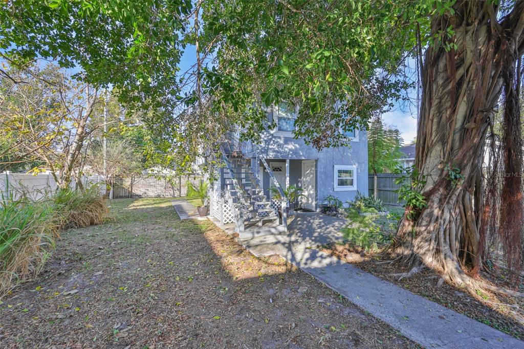 1208 17th Street North St. Petersburg, FL 33713 - Photo 3 of 15 a front view of a house with a yard