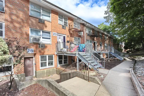 front view of a building with a bench