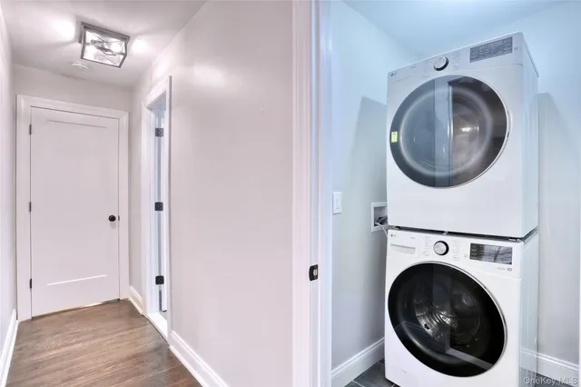 a view of a hallway with washer and dryer