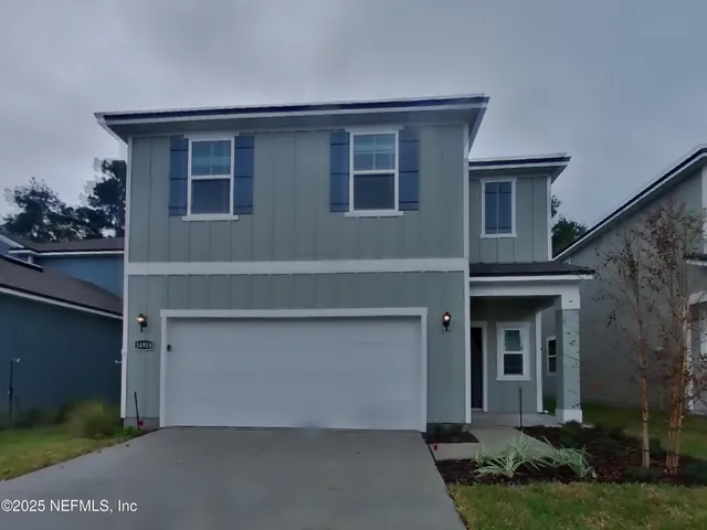 a front view of house with yard