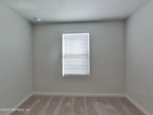 a view of a small space with a window